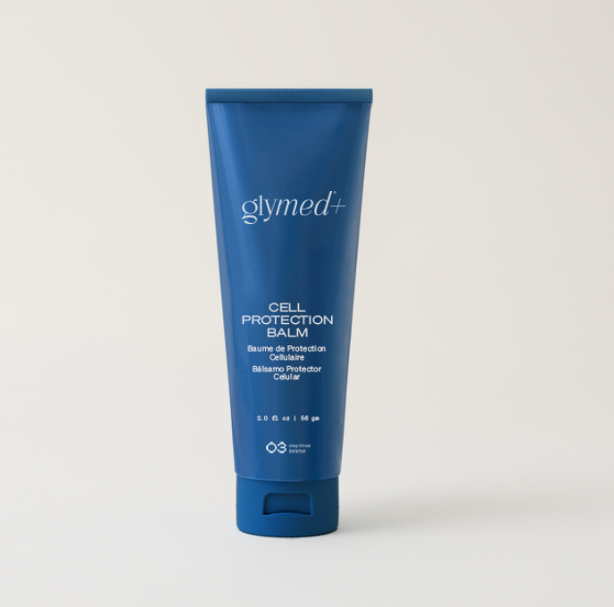 Blue tube of Glymed Plus Cell Protection Balm on a plain background. The product label includes text in English, French, and Spanish. Simple, clean design.